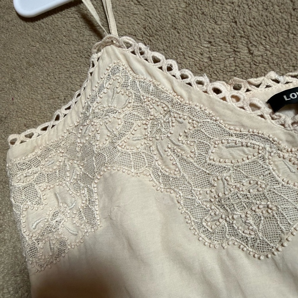 Love Sam lace peplum camisole top.
cream-colored
Pit to pit 19 1/2 inches - Picture 2 of 5